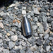 High‑pressure stainless steel jetting nozzle on gravel surface, precision‑machined orbital cleaning and cutting tool used for hydro‑excavation and industrial surface preparation with rotating zero‑degree water stream performance.