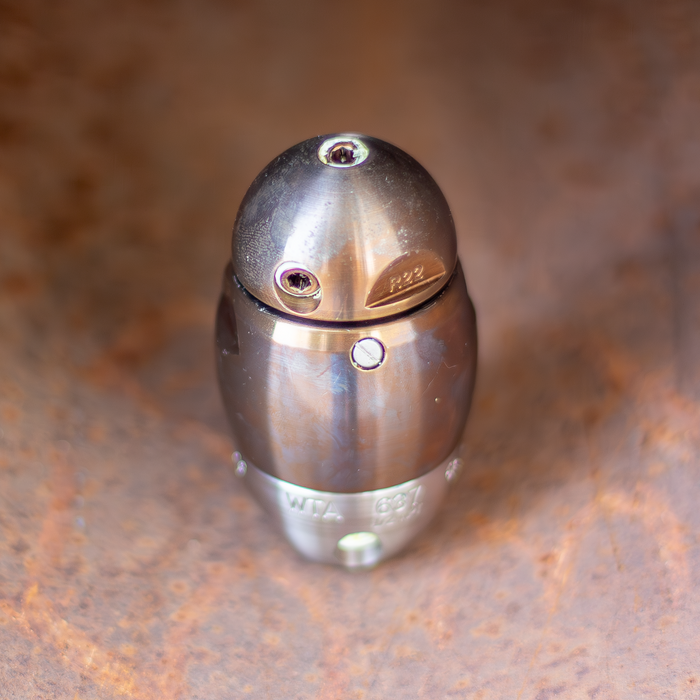 Warthog X high‑pressure sewer jetter nozzle in stainless steel, shown with forward, rear, and 90‑degree jet ports for pulling, descaling, and pipe wall cleaning in 3–8 inch sewer lines. Features premium carbide components, adjustable jet sizes, viscous‑fluid maintenance ports, and a compact, rebuildable design engineered for heavy‑duty drain cleaning and long‑radius elbows.
