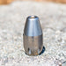 Stainless steel Enz Rotodrill high‑pressure sewer jetting nozzle, engraved 36.0XX max 36 GPM max 5000 PSI, Swiss‑made drain cleaning head on concrete surface.