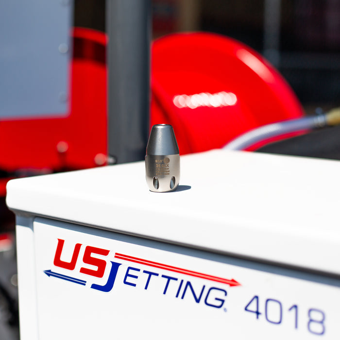 rotodrill stainless steel sewer jetting nozzle on US Jetting 4018 jetter, featuring precision rear jets for high‑pressure drain cleaning and professional hydro jetting performance.