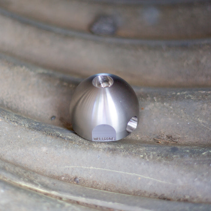 Warthog stainless steel descaling head for 1/2‑inch and 3/4‑inch WH Classic sewer jetting nozzles, featuring dual 105‑degree rear jets and optional plugged front port for maximum scale removal, tuberculation cleaning, and mineral buildup removal on high‑pressure jetting tools.