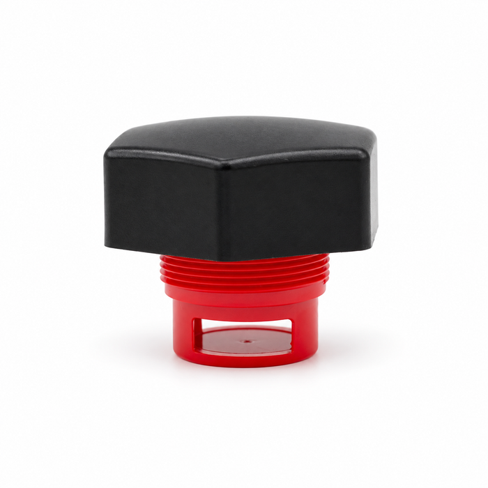 Front side view of a black hexagonal threaded cap with a red insert and rectangular side opening