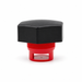 Front side view of a black hexagonal threaded cap with a red insert and rectangular side opening