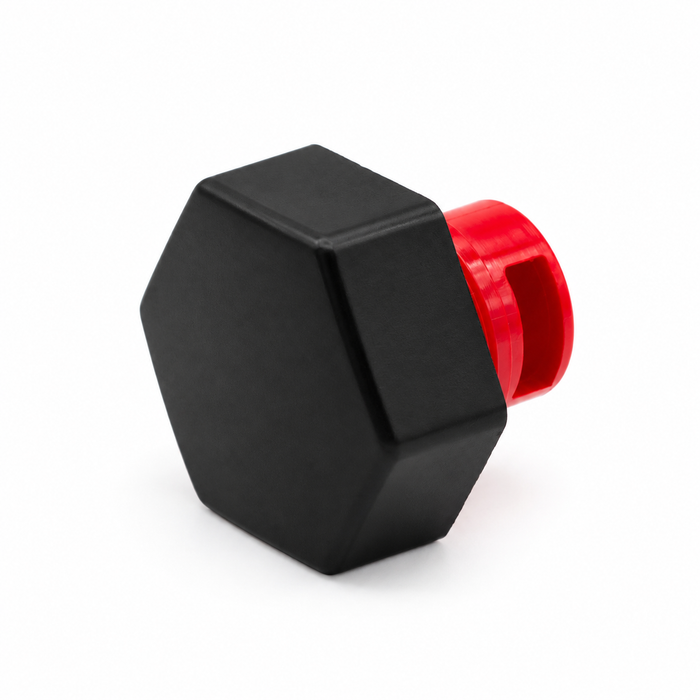 Black hexagonal threaded cap with red insert, shown at an angle on a white background