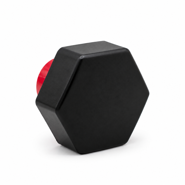 Black hexagonal threaded cap viewed from the front, with a red insert partly visible behind it