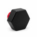 Black hexagonal threaded cap viewed from the front, with a red insert partly visible behind it