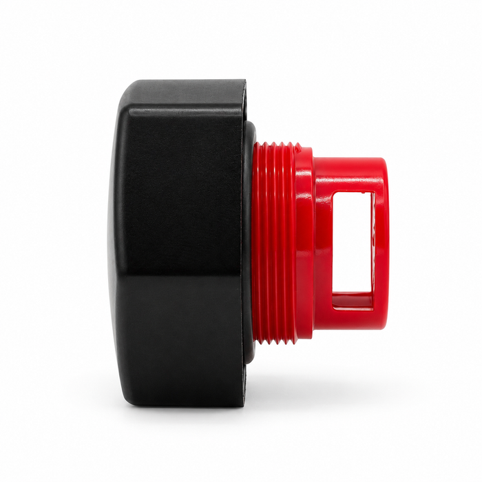 Side profile of a black hexagonal cap with a red threaded insert, rectangular side opening, and black sealing ring