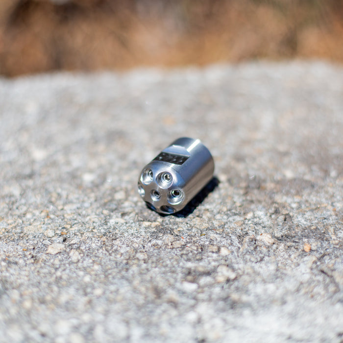 Digger sewer jetting nozzle on concrete surface – stainless steel front-jet drain cleaning nozzle engineered to push debris, sludge, and pipe scale out of small pipes; no rear jets for maximum forward water pressure, ideal for pipe lining prep and short runs under 100 feet requiring manual feed.